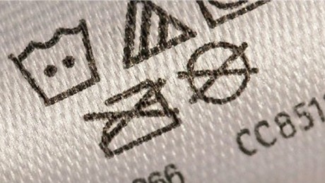 Close-up of a printed fabric label washing instruction
