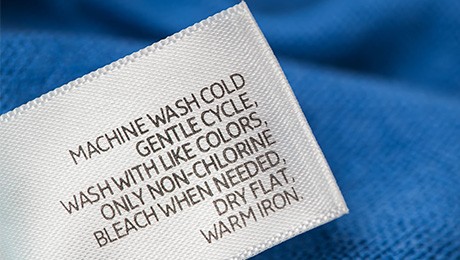Close-up of a printed fabric label washing instruction